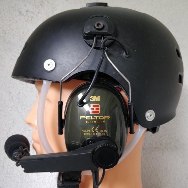 Skateboard helmet, accompanied by Peltor earmuffs and communication equipment, is a legitimate alternative to expensive off-the-shelf paramotor helmets, which are, in fact, built on the same principle. I use a military-grade differential dynamic microphone to achieve superior speech intelligibility.
