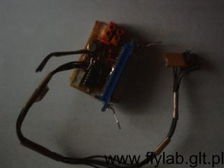 The controller board seen from above with bundles of wires leading out of it.