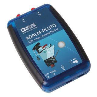 Blue and black plastic enclosure of the ADALM-PLUTO held in a hand.