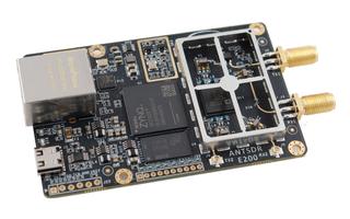 Black AntSDR E200 PCB with Ethernet socket and two SMA connectors.