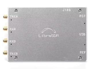 Silver aluminum case labeled LibreSDR with four yellow SMA connectors.